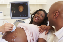 pregnant woman going for sonogram with loved one offering support